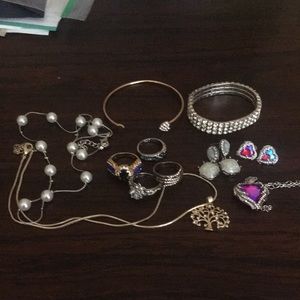 Women’s 11 piece bundle of costume jewelry. All new.